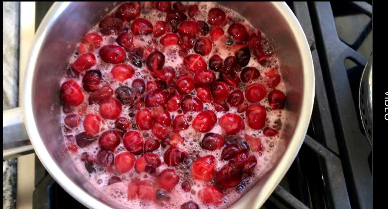Fresh Cranberries Simmering Into A Syrup