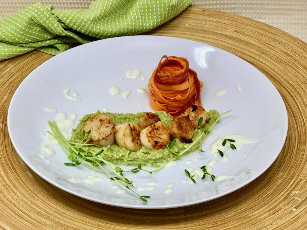 Scallops over pea pesto