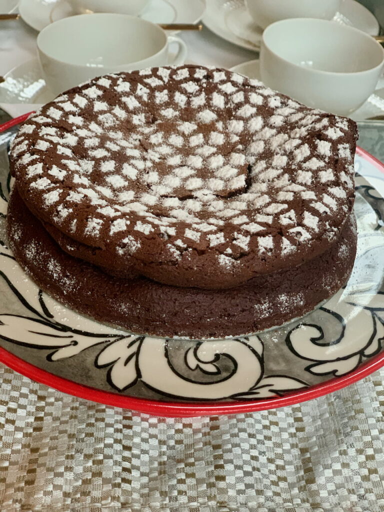 Flourless Chocolate Cake With A Simple Powdered Sugar Dusting