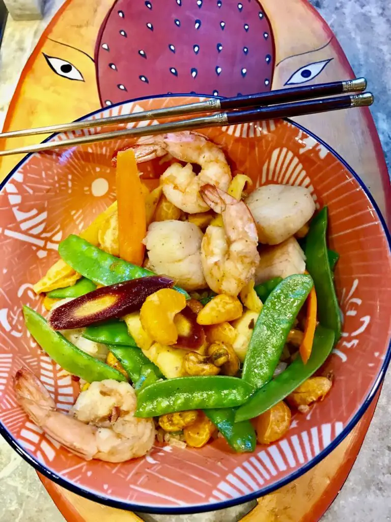 Healthy and satisfying Simple Seafood Stir Fry with shrimp and scallops in an Asian infused sauce with colorful veggies and a bit of heat. 