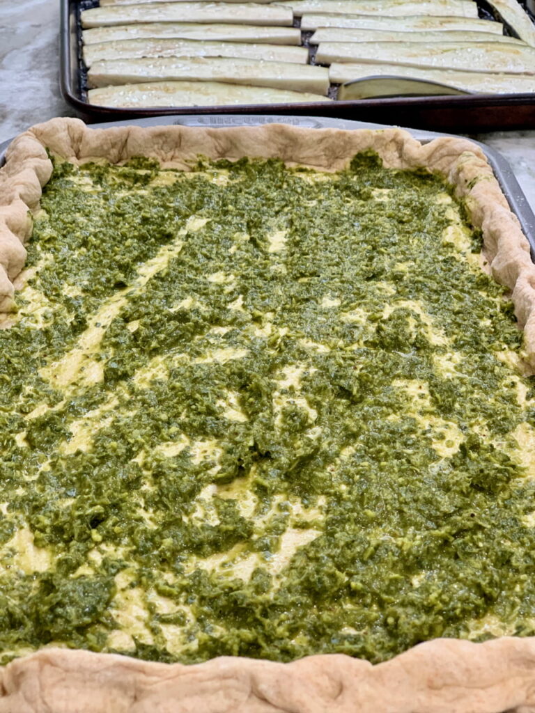 Chermoula sauce spread on top pizza dough