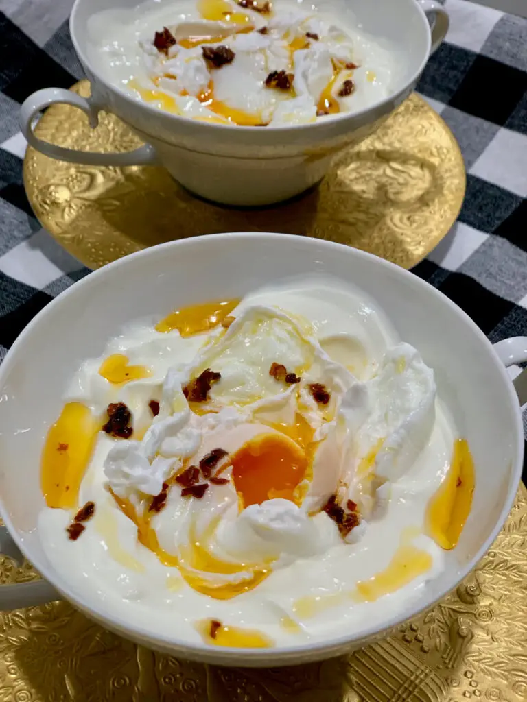 Cilbir - Savory garlic yogurt with poached eggs.