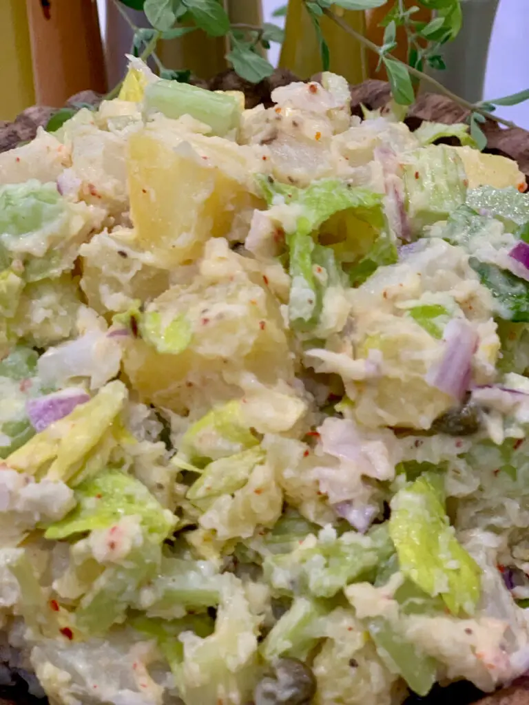 potato salad with homemade mayonnaise and garden greens