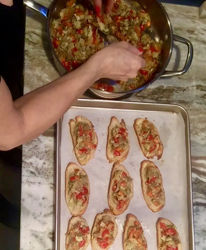 Placing the ratatouille on the bread slices