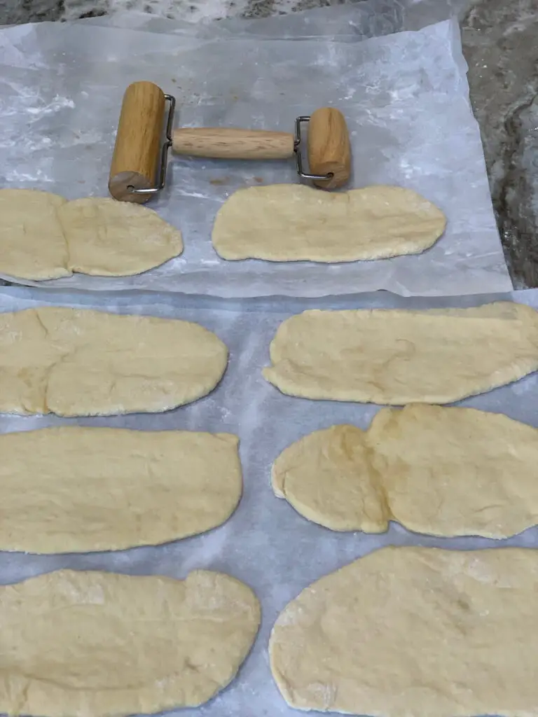 Rolling The Pita Dough Into Shape