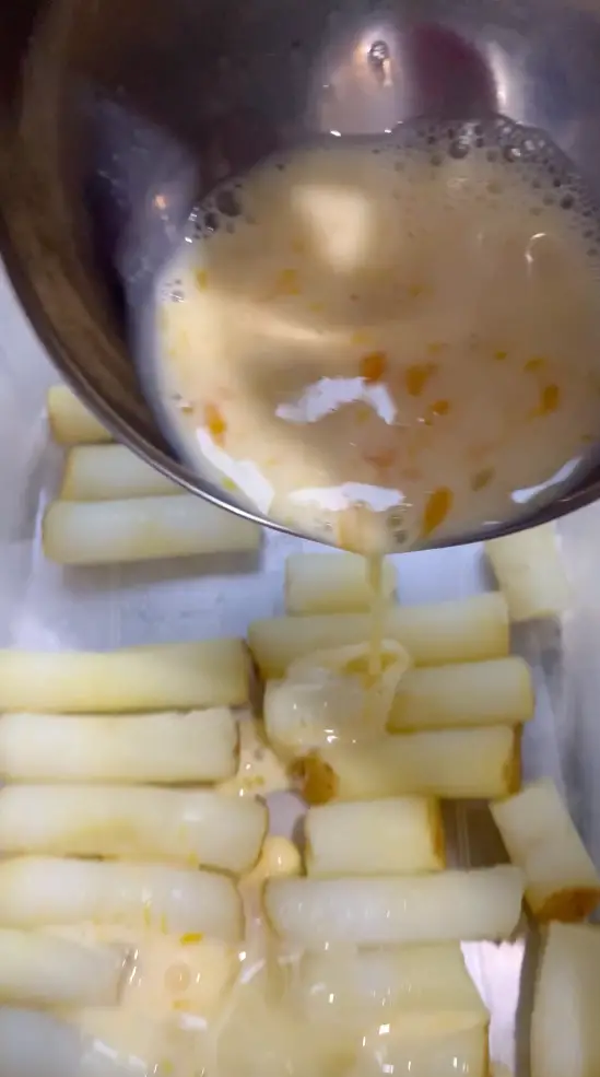 Coat The Potatoes In An Egg, Milk, Garlic Mix