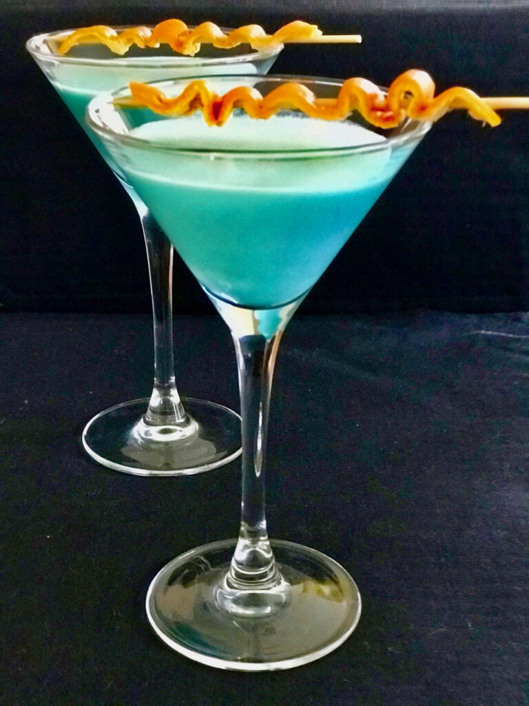 Blue Moon Curacao Vodka Cocktail With Sugared Orange Rind Garnish