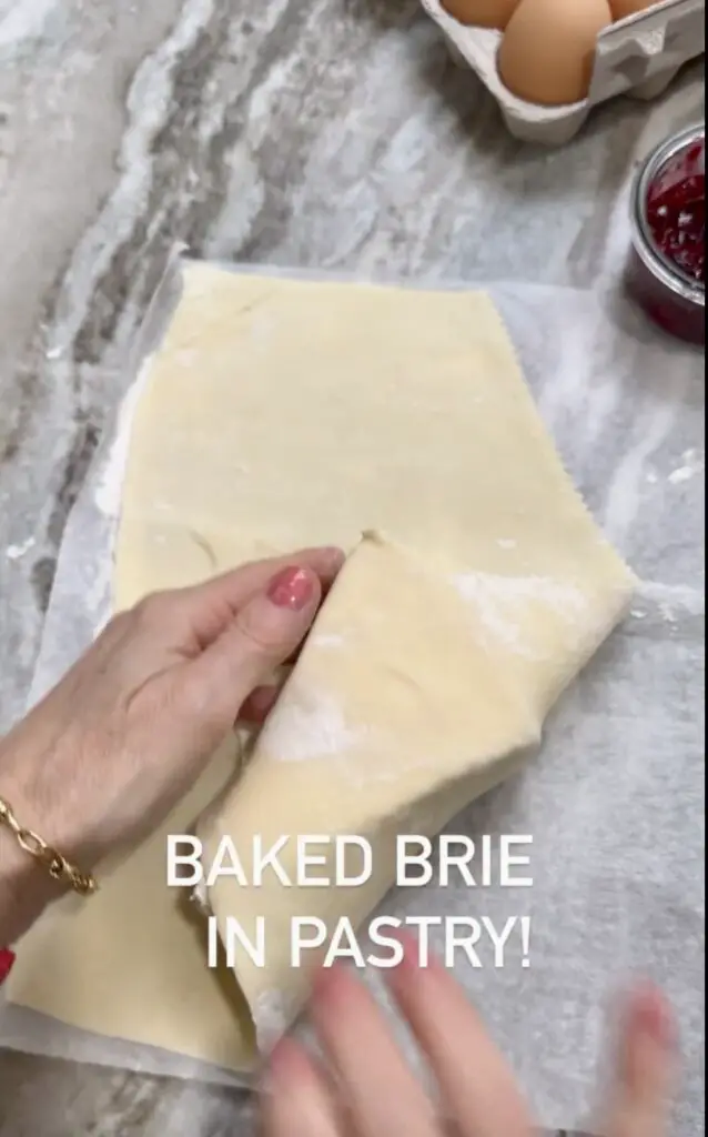 Folding Pastry Around The Brie Before Baking