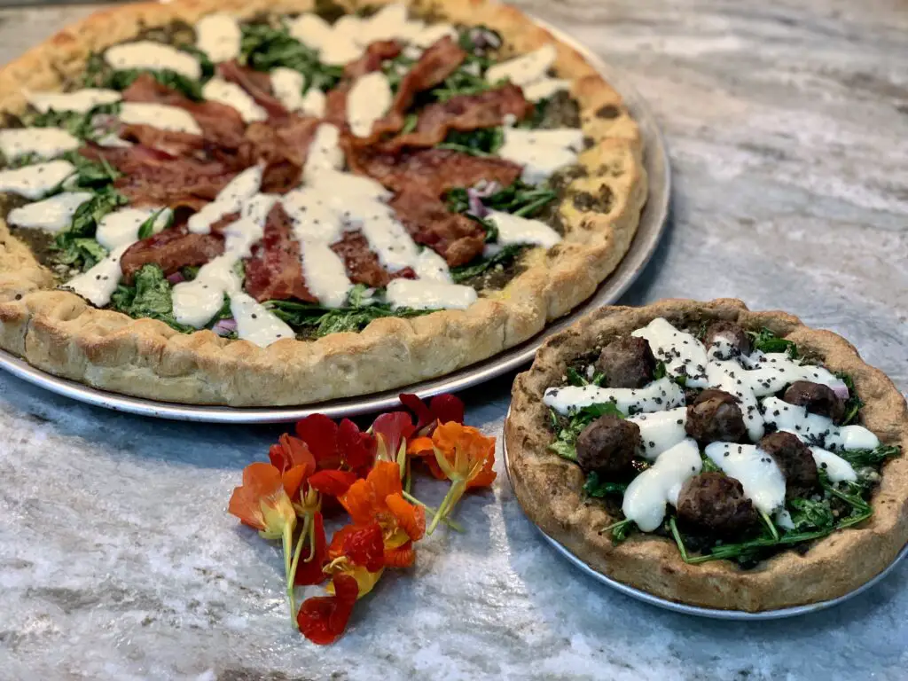Spelt Crust with Venison Meatballs and Wheat Crust with Bacon - Both with Spinach Pesto