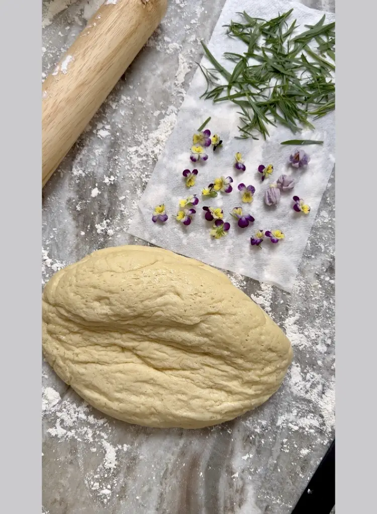 Tarragon and Viola Flowers Await Bread Dough To Be Rolled Out