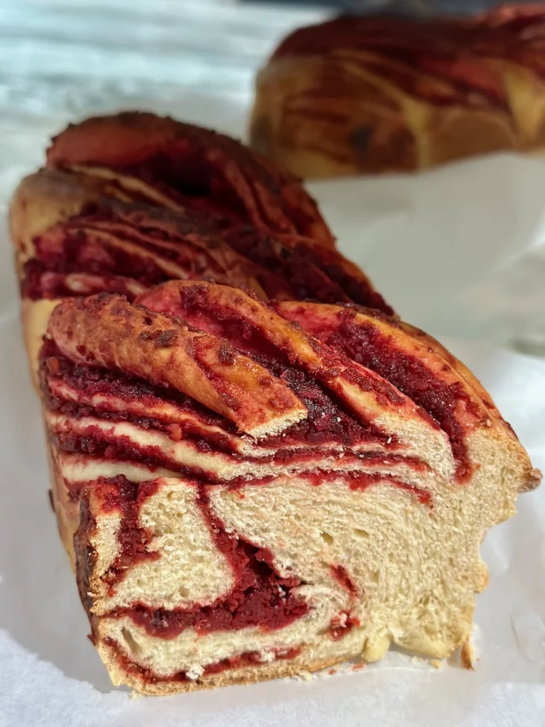 Luscious Close Up Of Carrot Beetroot Halva Babka with Crushed Almonds