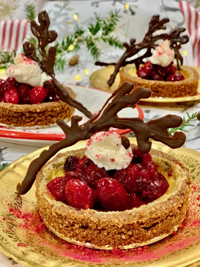 Cranberry Cheesecake With Chocolate Antlers And Rudolph's Red Nose Cranberry Compote