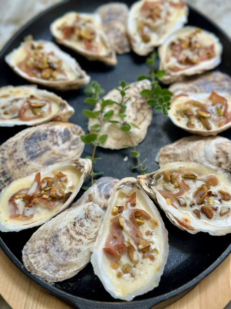 Oyster In Champagne Sauce With Prosciutto And Pistachios