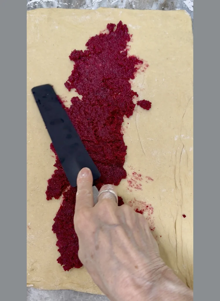 Spread A Thin Layer Of Tahini Beet and Carrot Halva Onto The Prepared Dough