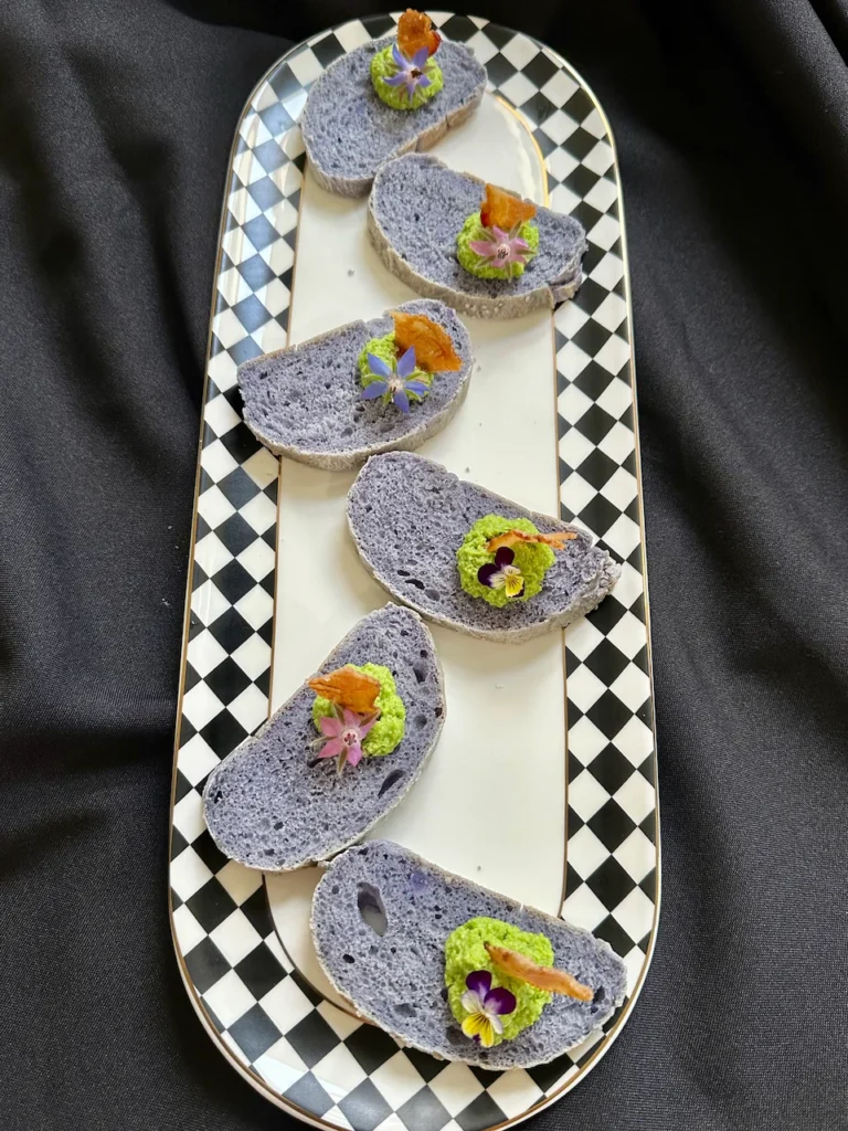The Perfect Appetizer - Purple Sweet Potato Bread Crostini with Pea Pesto and Edible Flowers