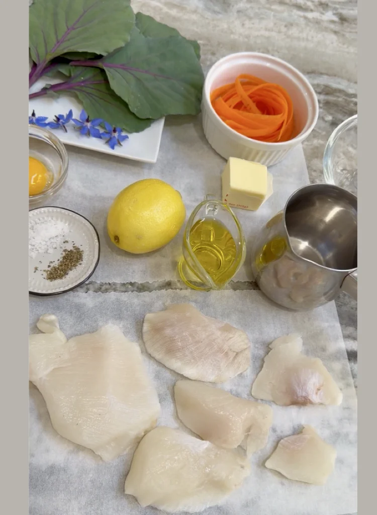 Ingredients for Halibut Fish Cheeks and Avgolemono Over Garden Leaves