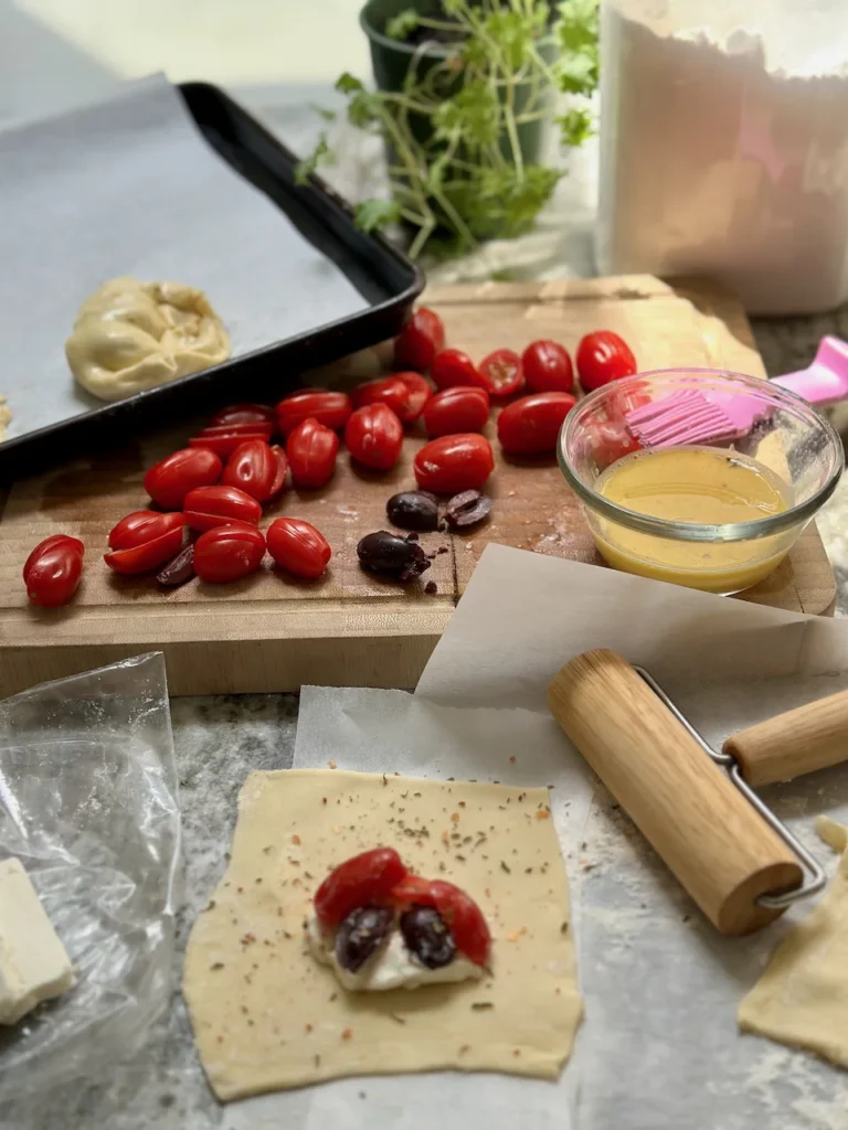 Homemade Tortellini Filled with Tomatoes, Olives, Cheese and Herbs