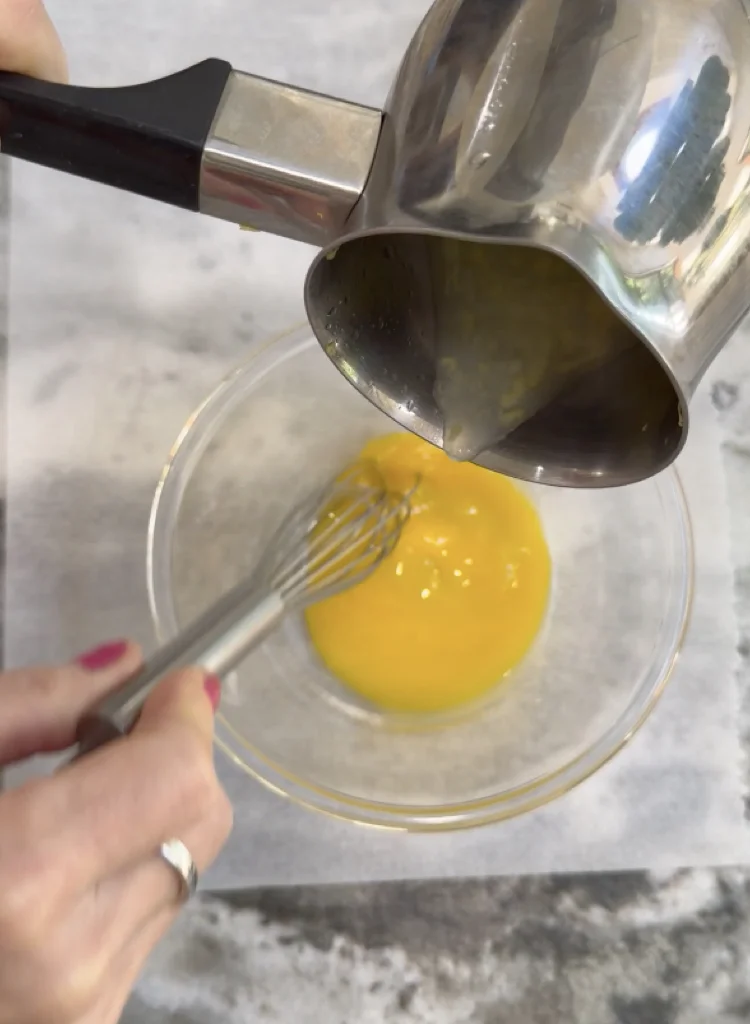 Slowly Temper the Egg Yolks with Hot Lemon Juice