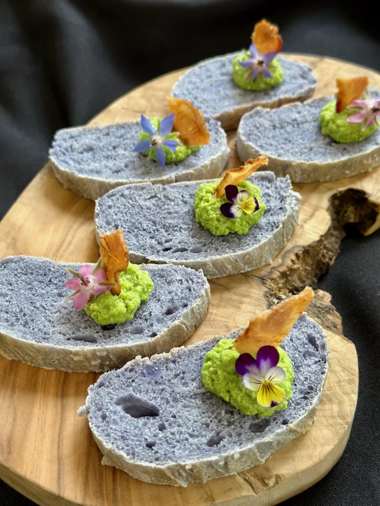 Stunning Purple Sweet Potato Bread Turned Into Elegant Crostini with Bright Pea Pesto