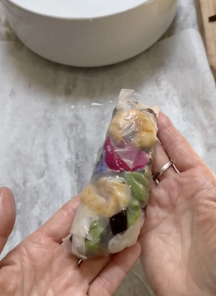 Easily Wrapped Rice Paper with Colorful Garden Ingredients Visibly Tucked Inside